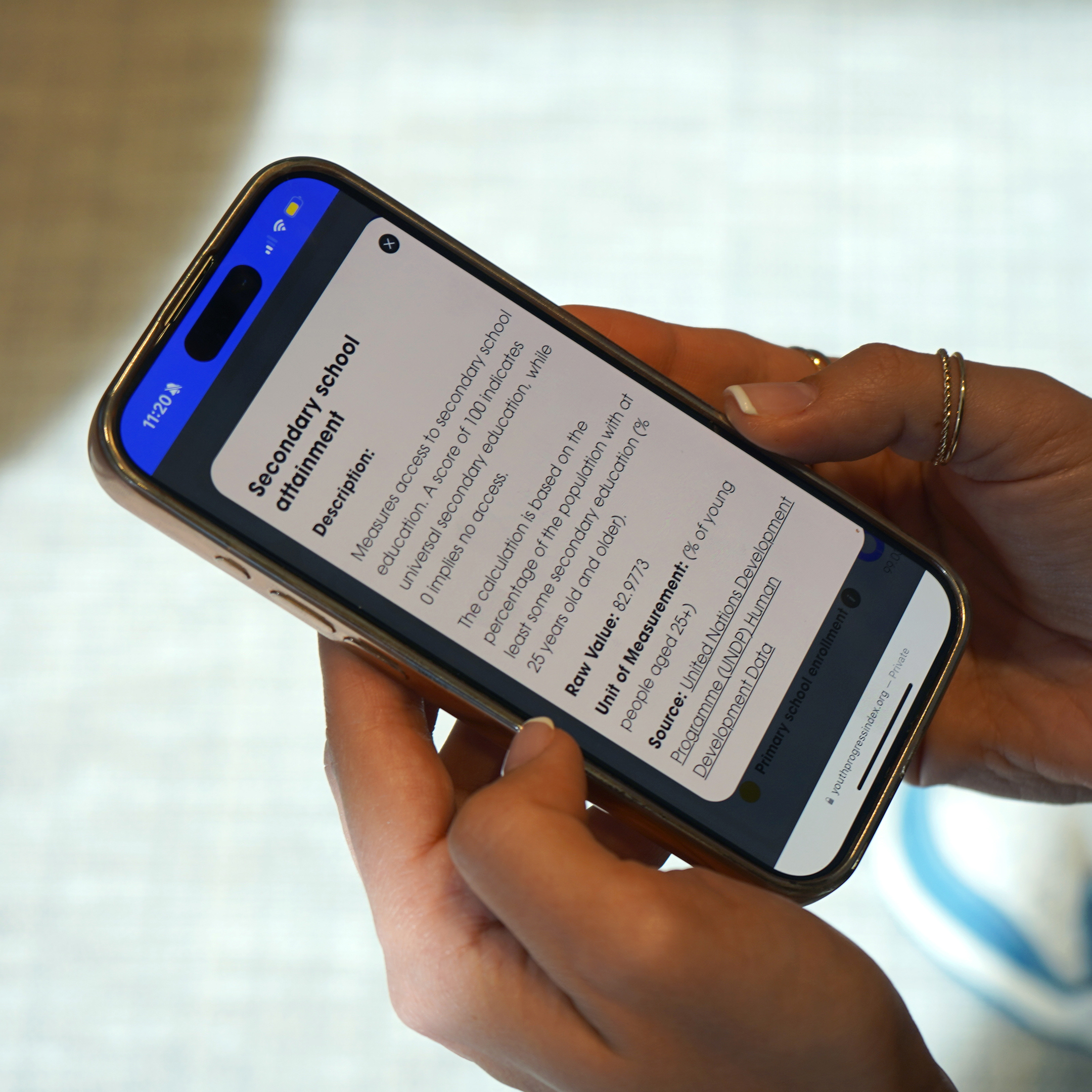 person checking the youth progress index on the phone